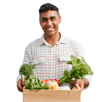 A seasonal worker holding a crate of fresh produce